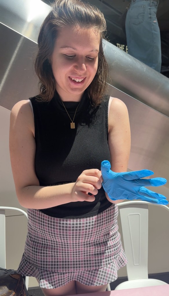 Charlene wearing blue gloves