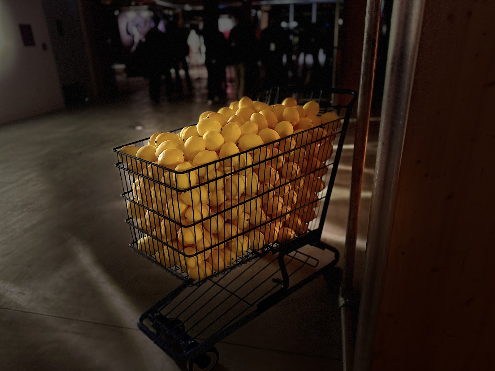Photo of a shopping cart of lemons.