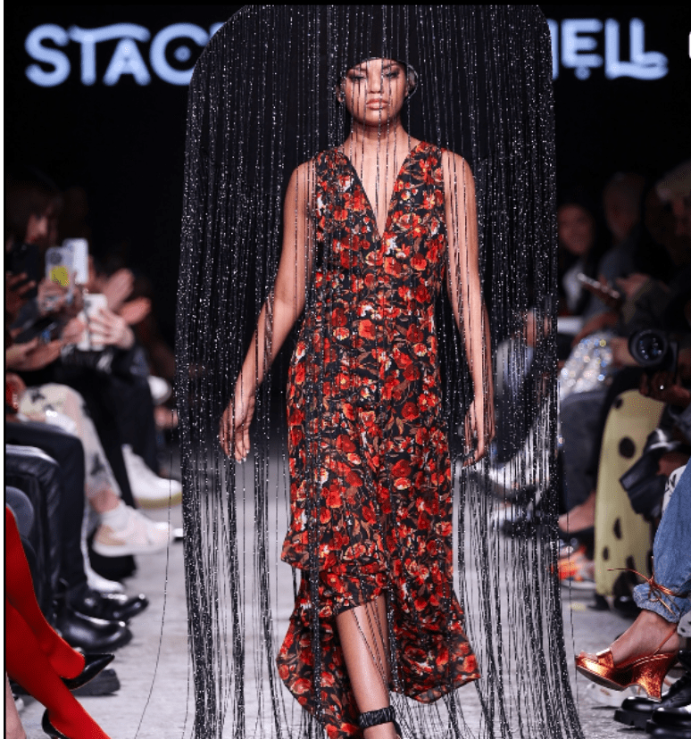 Model Sienna Leah walks the Fashion Art Toronto runway with a beaded statement hat. 